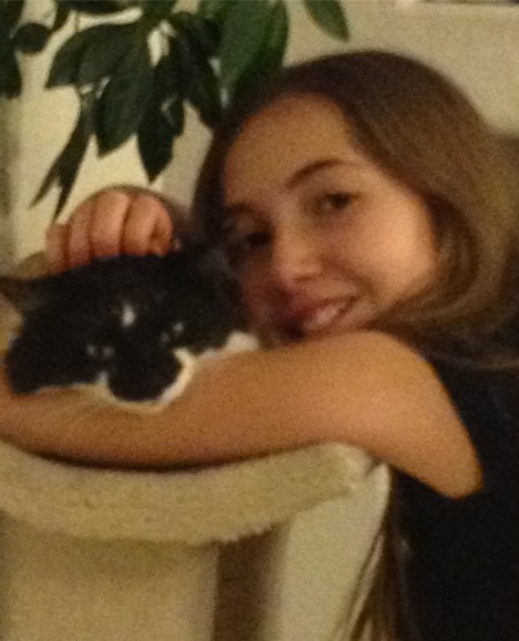 HCWS Youth Group member Sage (pictured with her cat, Tippie) designed jewelry to help the cats and dogs in our care.